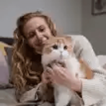 cat held byowner blond 460x460 min